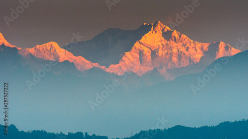A view of Snow clad Kangchenjunga, also spelled Kanchenjunga, is the third highest mountain in the world. It lies between Nepal and Sikkim, India, 