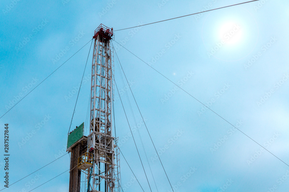 Fototapeta premium Oil and Gas Drilling Rig. Oil drilling rig operation on the oil platform in oil and gas industry. Petroleum Industry.