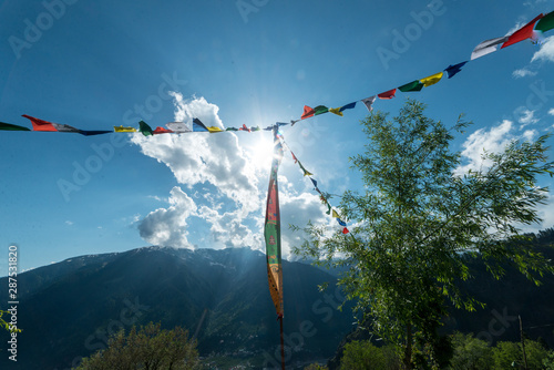 Budhist flags in the mountains near hamta photo