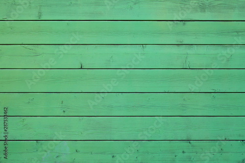 Green colored pastel wood background. Wooden abstract background.