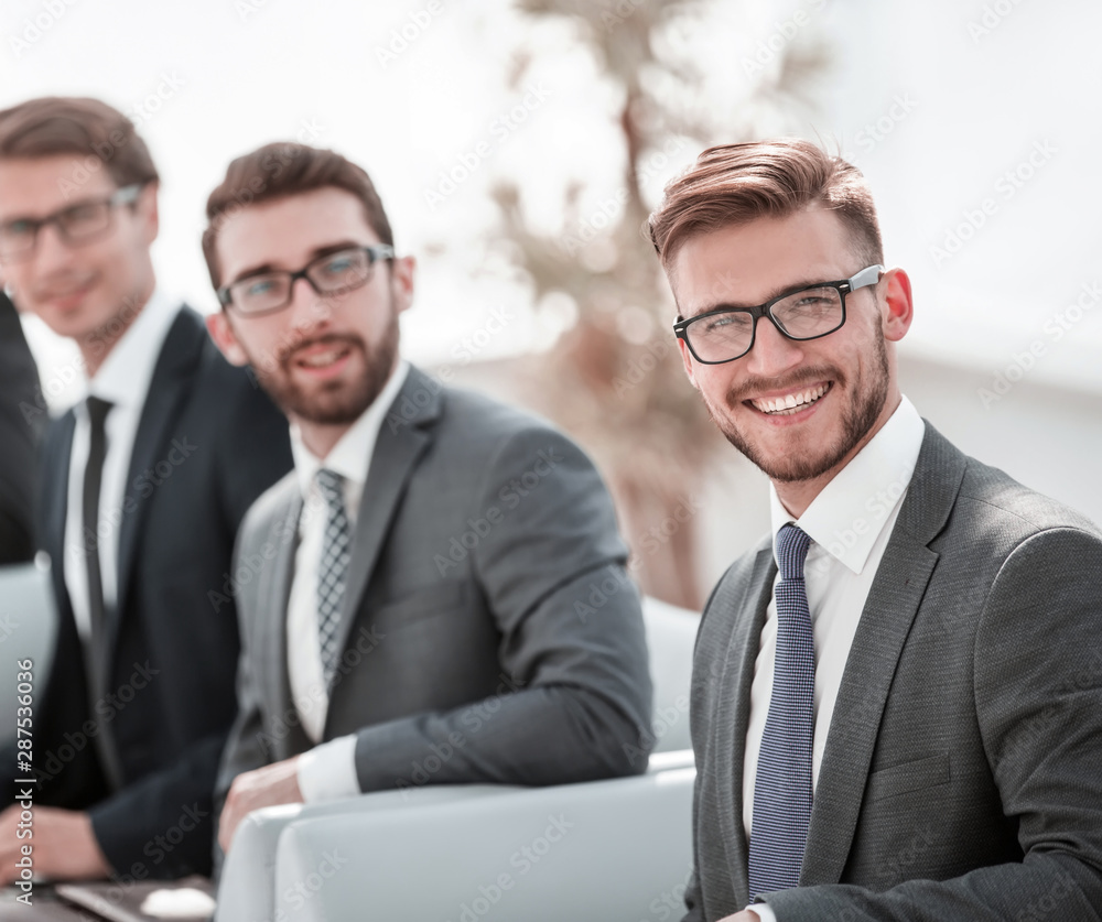 businessman and a group of colleagues waiting for the start of a business meeting businessman and a group of colleagues waiting for the start of a business meeting