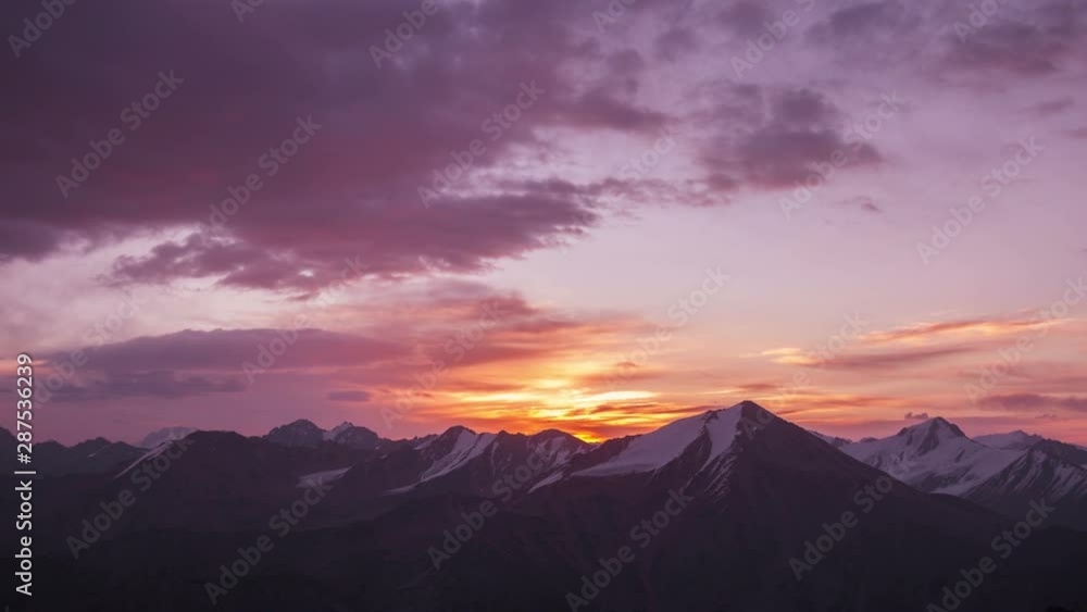 Time lapse zoom in of Tian Shan mountain peaks with glaciers at sunrise Time lapse zoom in of Tian Shan mountain peaks with glaciers at sunrise