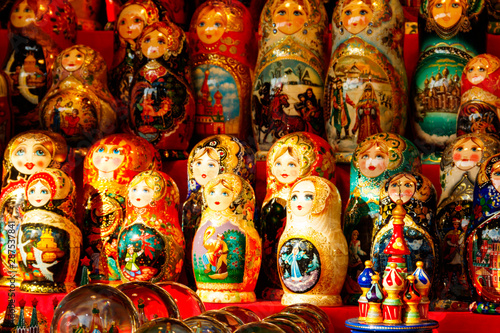 Traditional souvenirs from Russia - colorful nesting dolls, also known as matryoshka, babushka, stacking dolls, or Russian dolls © olyasolodenko
