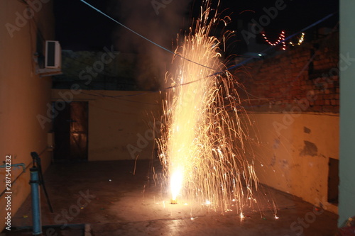 A Flower Pot fire cracker, also known as Anar, is mostly burnt on the night of Diwali releasing a spectacular outburst of sparkles upwards photo