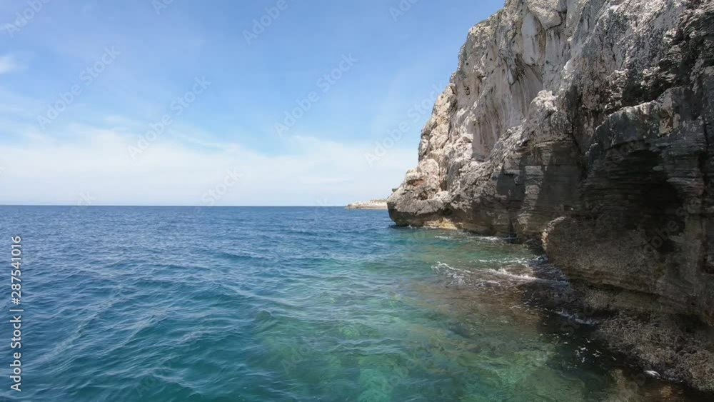 Croatian shoreline with tall cliffs and deep blue water Croatian shoreline with tall cliffs and deep blue water