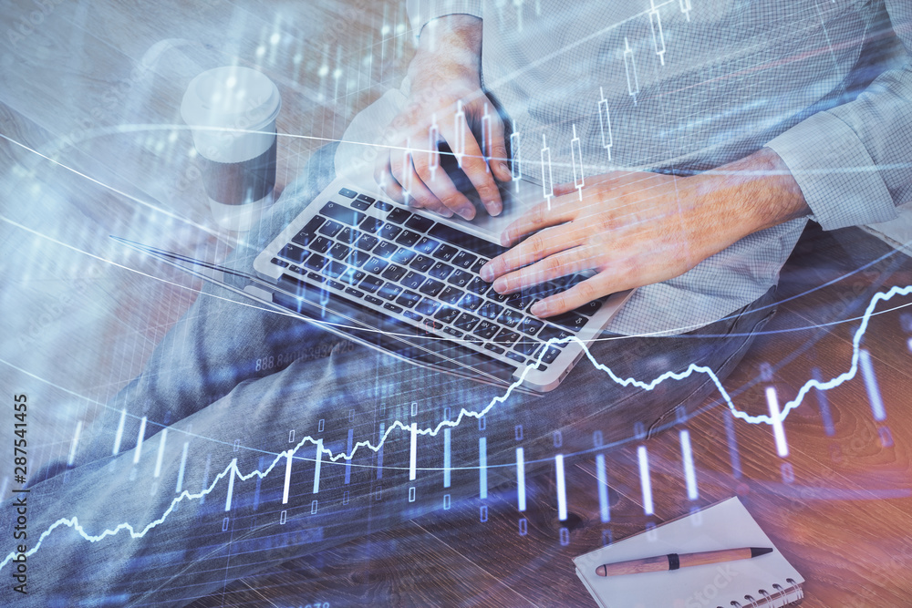 Forex graph with businessman working on computer in office on background. Concept of analysis. Double exposure. Forex graph with businessman working on computer in office on background. Concept of analysis. Double exposure.