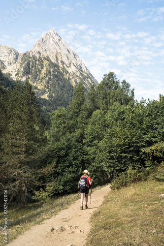 woman hiking in the national park d´aiguestortes in the Pyrenees in Spain