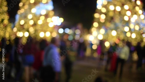 people walking on city street at night