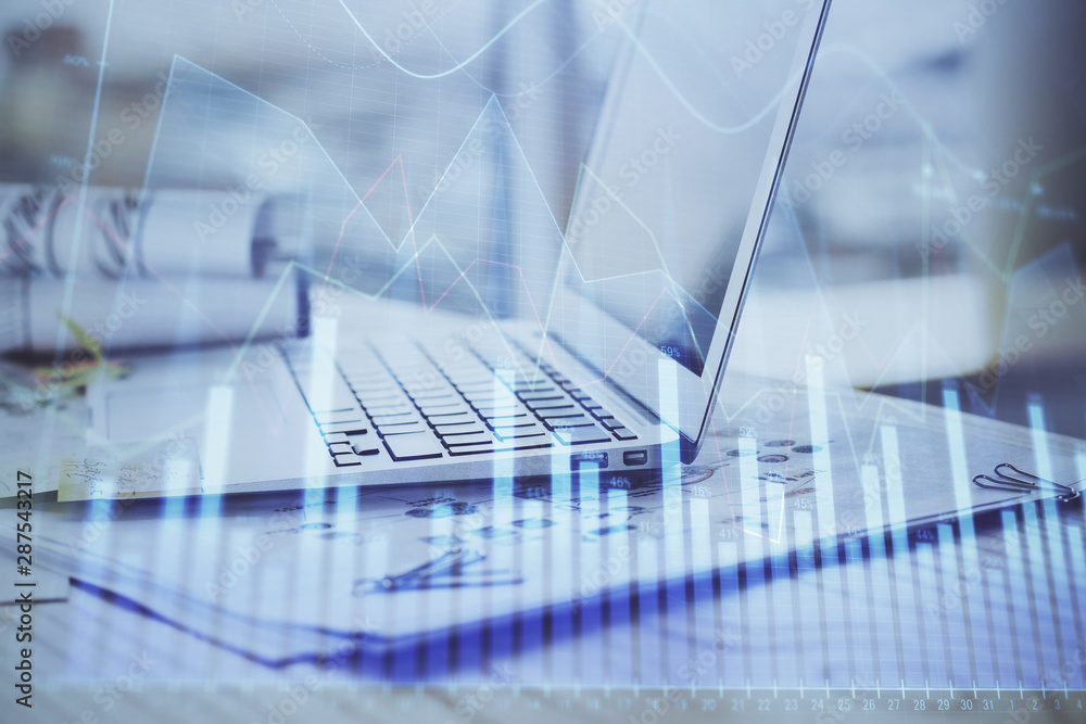 Stock market graph and table with computer background. Double exposure. Concept of financial analysis. Stock market graph and table with computer background. Double exposure. Concept of financial analysis.