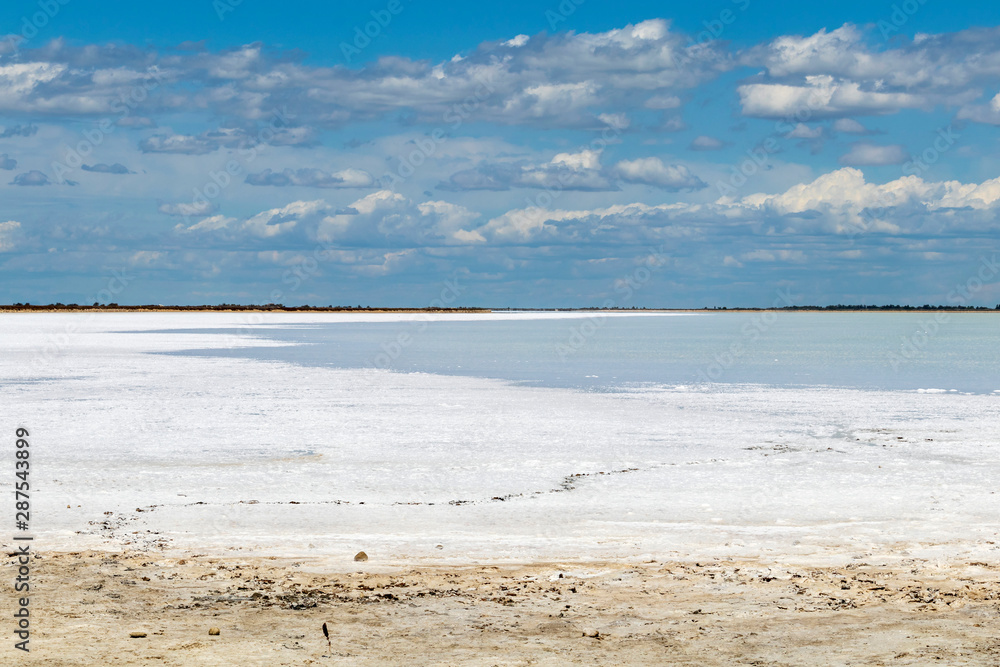 Obraz premium Camargue white salt flat lake, etang salt water lagoon surrounded by sand dunes, Southern France