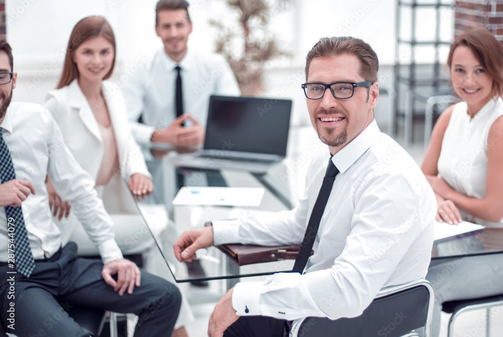 boss and business team sitting at their Desk boss and business team sitting at their Desk