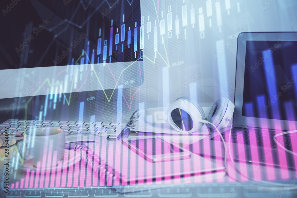 Forex market chart hologram and personal computer background. Multi exposure. Concept of investment. Forex market chart hologram and personal computer background. Multi exposure. Concept of investment.