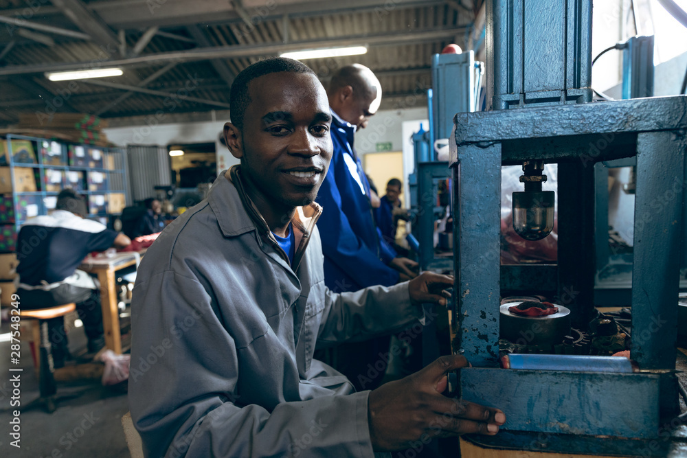 Portrait of a young man in a clothing factory Portrait of a young man in a clothing factory