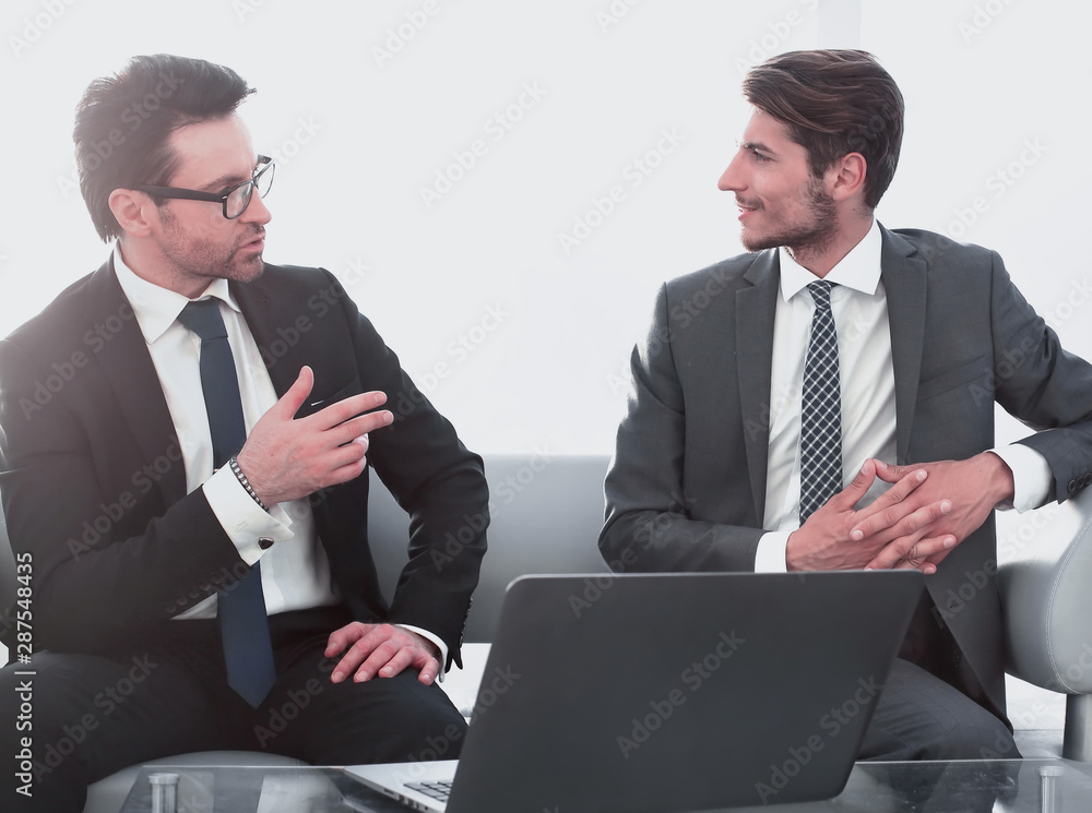 business partners at a business meeting in the lobby of the business center business partners at a business meeting in the lobby of the business center
