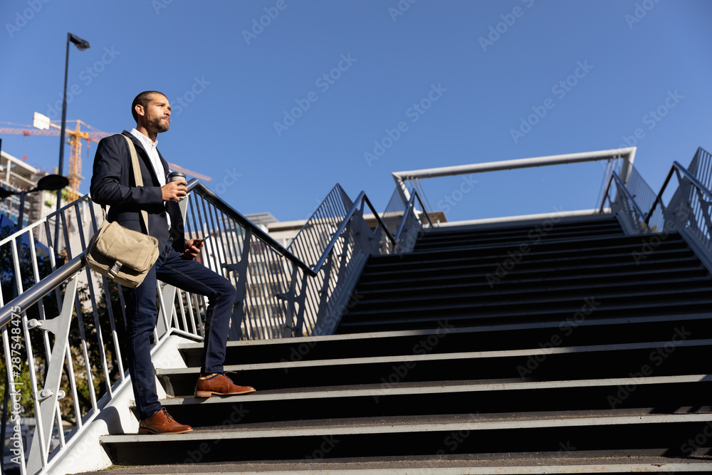 Young professional man taking a break on his way to work Young professional man taking a break on his way to work