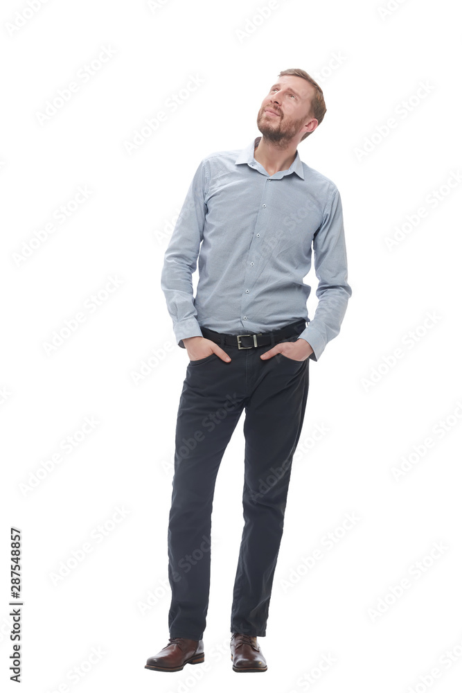 in full growth. brooding businessman looking somewhere up in full growth. brooding businessman looking somewhere up
