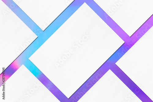 Close up of empty white rectangle poster mockups lying diagonally with soft shadow on holographic background. Flat lay, top view. Open composition.