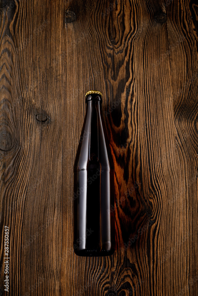 beer bottle on wooden table . Top view - obrazy, fototapety, plakaty 