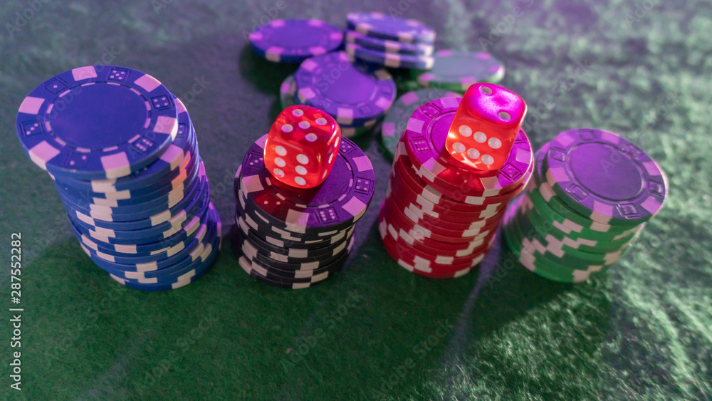 poker chips, dice on table close up