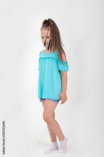Thoughtful little girl six years old daughter look away on copy space thinking isolated on grey beige background, funny kid pout lips hold finger near mouth conceived some kind of prank, concept image © Delete