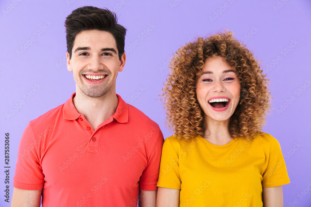 Portrait of beautiful caucasian people man and woman in basic clothing laughing together at camera Portrait of beautiful caucasian people man and woman in basic clothing laughing together at camera