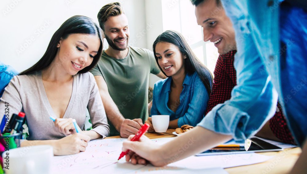 Modern happy start up team in casual clothes in office or co-working space are working and discussion them plans and ideas. Modern happy start up team in casual clothes in office or co-working space are working and discussion them plans and ideas.
