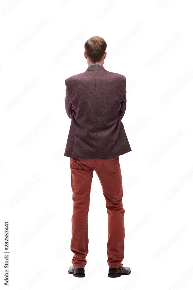 Fototapeta premium rear view. young man standing in front of white blank screen