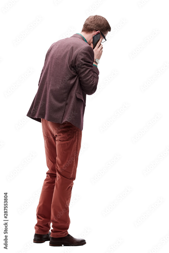 rear view. young man with smartphone looking at blank screen rear view. young man with smartphone looking at blank screen
