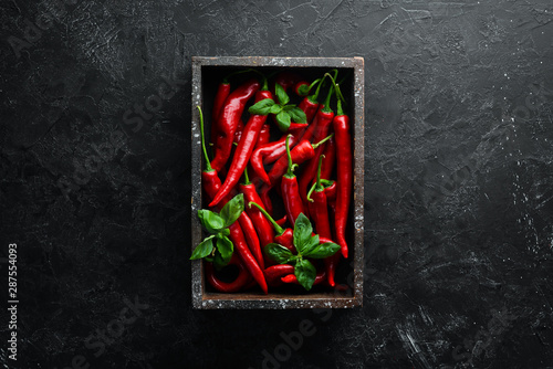 Fresh chili peppers in wooden box Fototapeta
