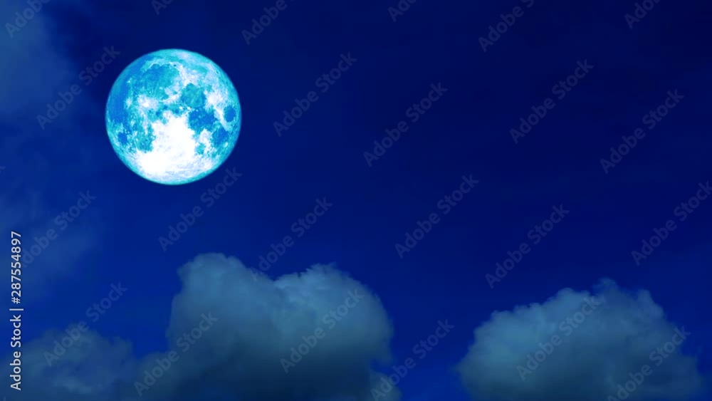 full harvest blue moon moving pass back cloud on dark night sky full harvest blue moon moving pass back cloud on dark night sky