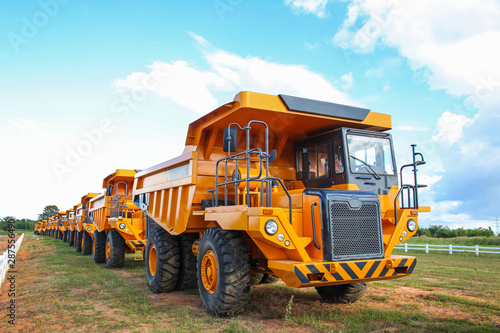 Yellow mining trucks photo