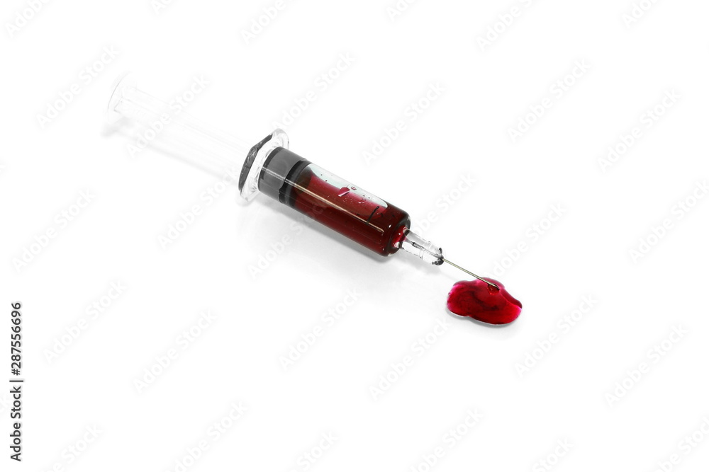 Isolated syringe have red blood inside with needle and some blood drop on floor on white background Isolated syringe have red blood inside with needle and some blood drop on floor on white background
