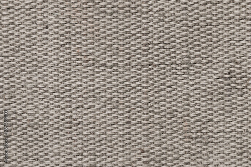 The texture of the fabric closeup. A fragment of factory fabric.