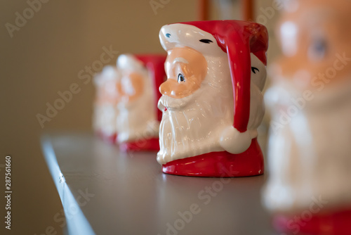 Row of Ceramic Santa Mugs