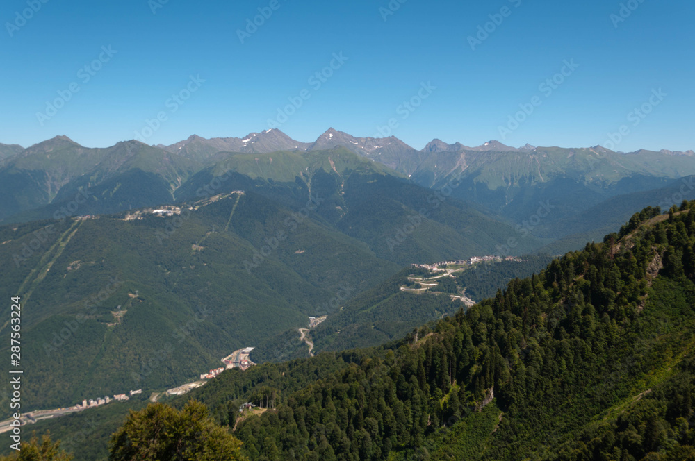 a group of hotels surrounded by forests and mountains a group of hotels surrounded by forests and mountains