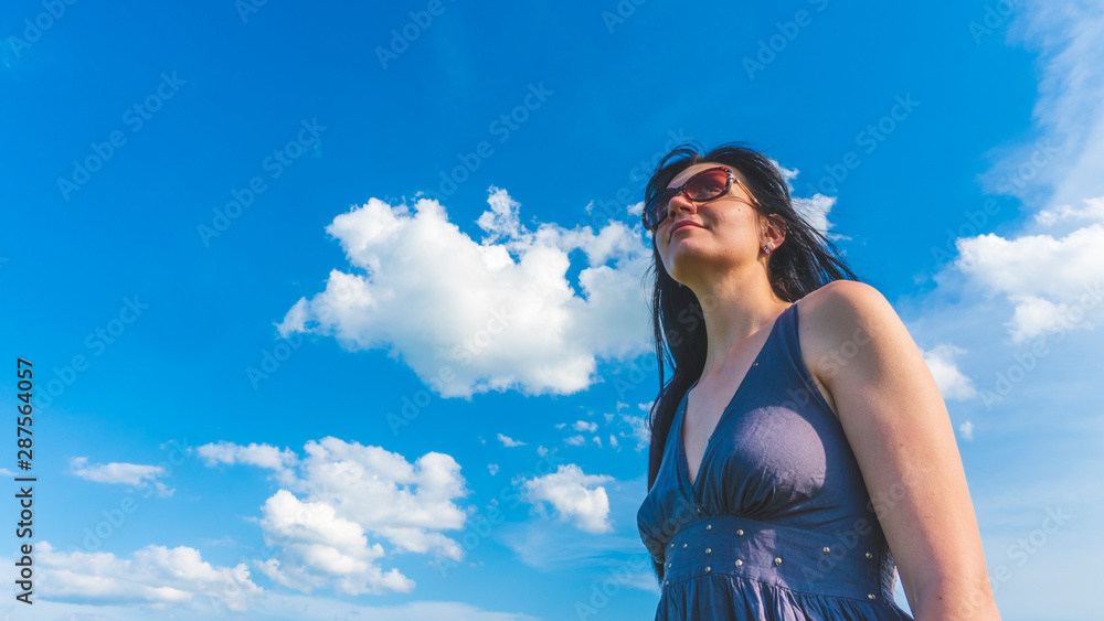 girl on a hill against the sea