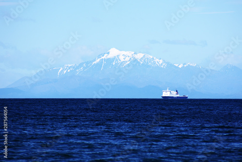 Bluebridge ferry crossing the cook straight, New Zealand with South Island mountain views photo