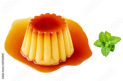 Caramel custard pudding with mint. Homemade caramel dessert or flan  isolated on a white background..