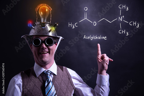 Nerd presenting handdrawn chemical formula of acetylcholine