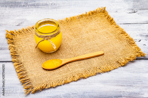 Pure or desi ghee (ghi), clarified melted butter photo