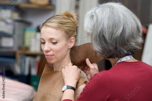 young woman having a costume fitting