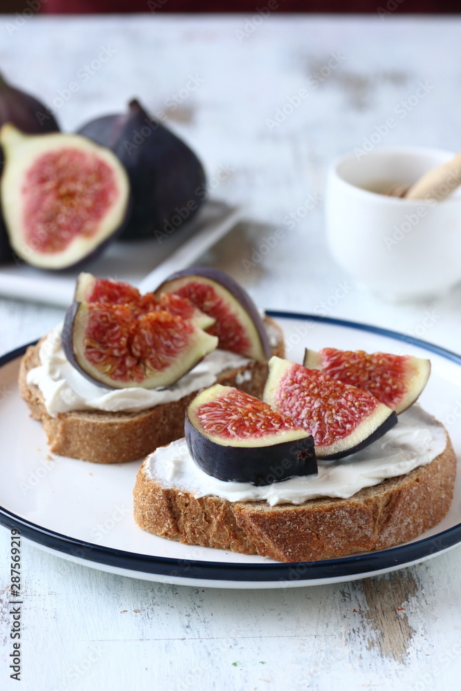Sandwich with figs and honey, cream cheese,honey and bread slice Sandwich with figs and honey, cream cheese,honey and bread slice