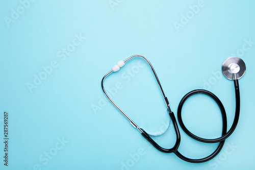 Medical stethoscope on a blue background. Health care concept photo