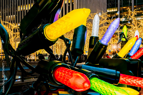 New York City, NY, USA - December, 2018 - Streets of Manhattan, Sixth Avenue decorated with huge colorful lights for Christmas.