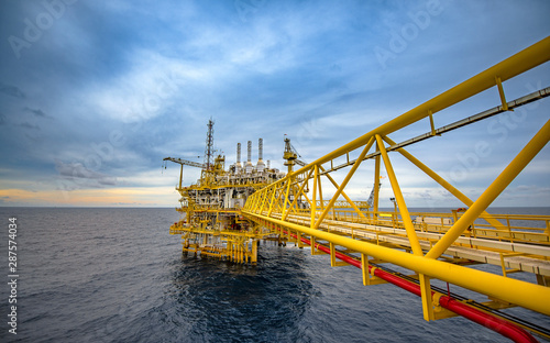 Offshore oil and gas rig platform with beautiful sky in the gulf of Thailand.