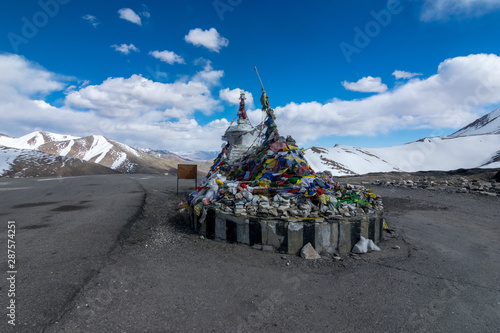 taglanga pass in Leh Ladakh with praying flag on sunny blue sky day. photo