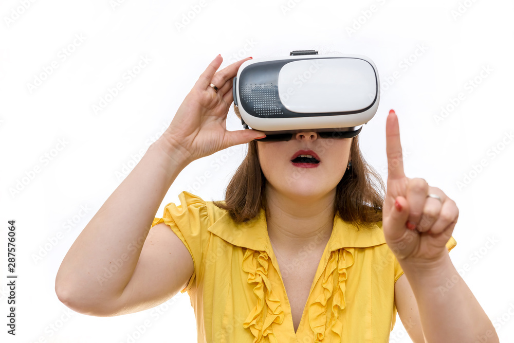 Woman shows gestures in glasses of virtual reality in her hands, isolated on white background Woman shows gestures in glasses of virtual reality in her hands, isolated on white background