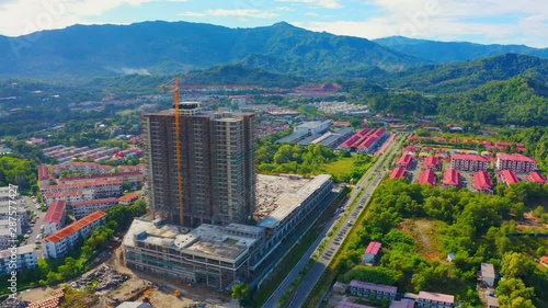 Aerial drone footage of apartment being on constructed at Menggatal, Sabah, Malaysia photo