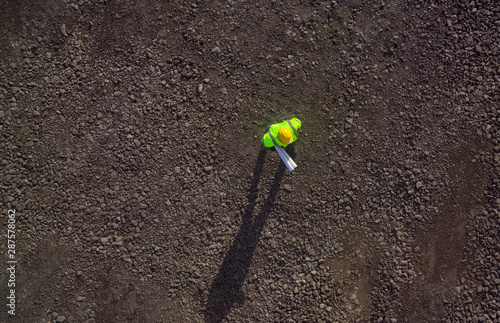 Construction worker from above on gravel photographed