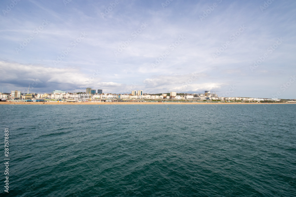 Brighton UK, 10th July 2019: The famous beautiful Brighton Beach and Seafront showing the coastline area on a bright sunny day,